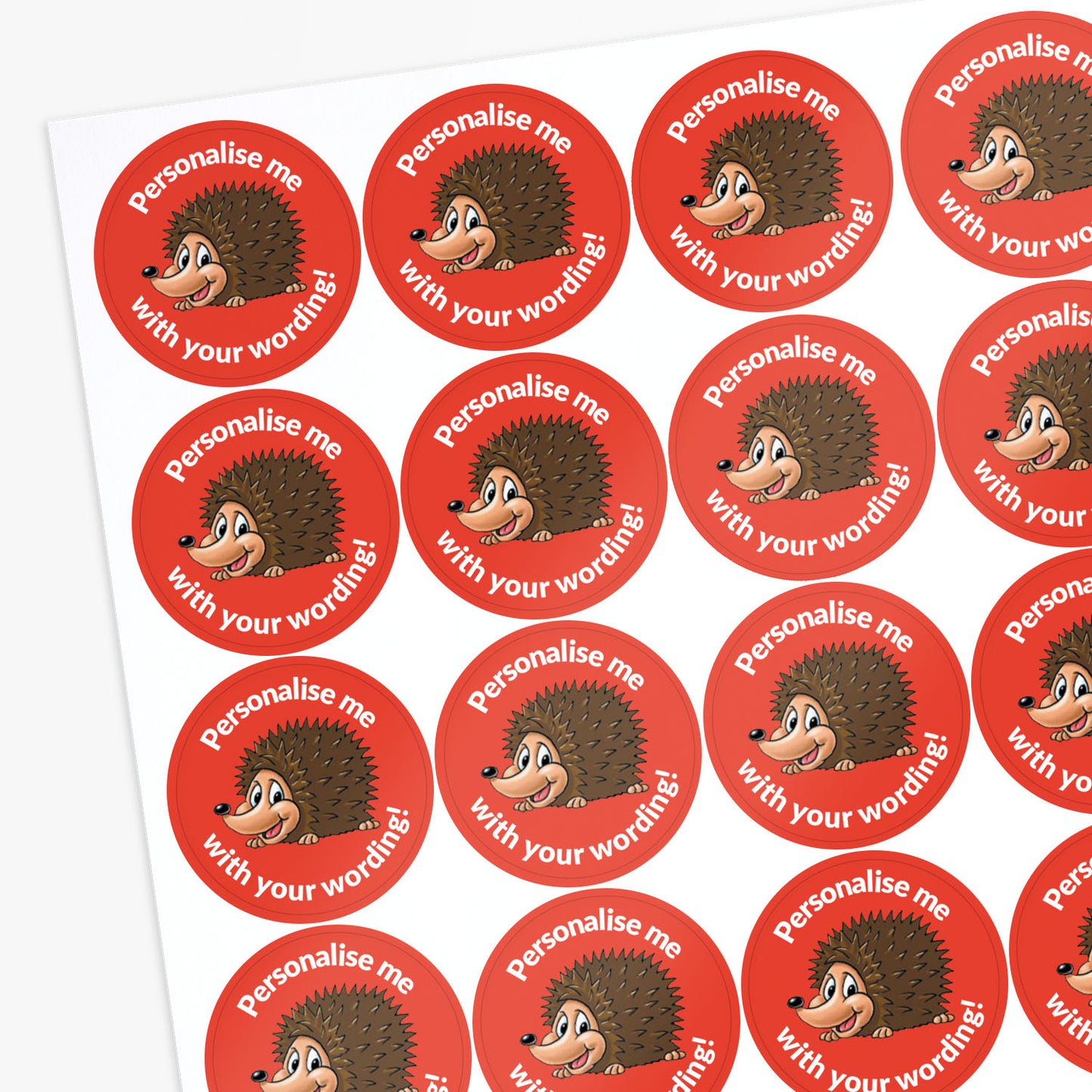 Red stickers with a smiling hedgehog as a central image. Space for personalisation above and below the image.
