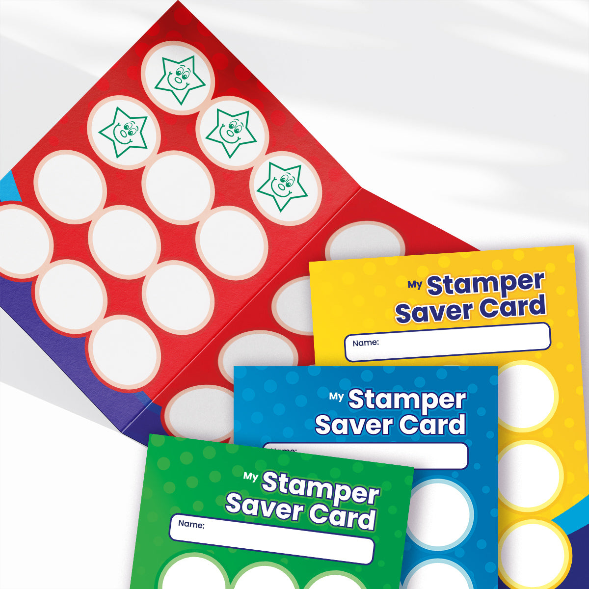 A set of brightly coloured 'Stamper Saver Cards' for tracking student rewards. One red card is opened, showing circular spaces for stamps, some filled with green star designs featuring smiley faces and one gold star sticker. Below are additional cards in blue, yellow, green, and purple, each with a blank name section and the title 'My Stamper Saver Card'.