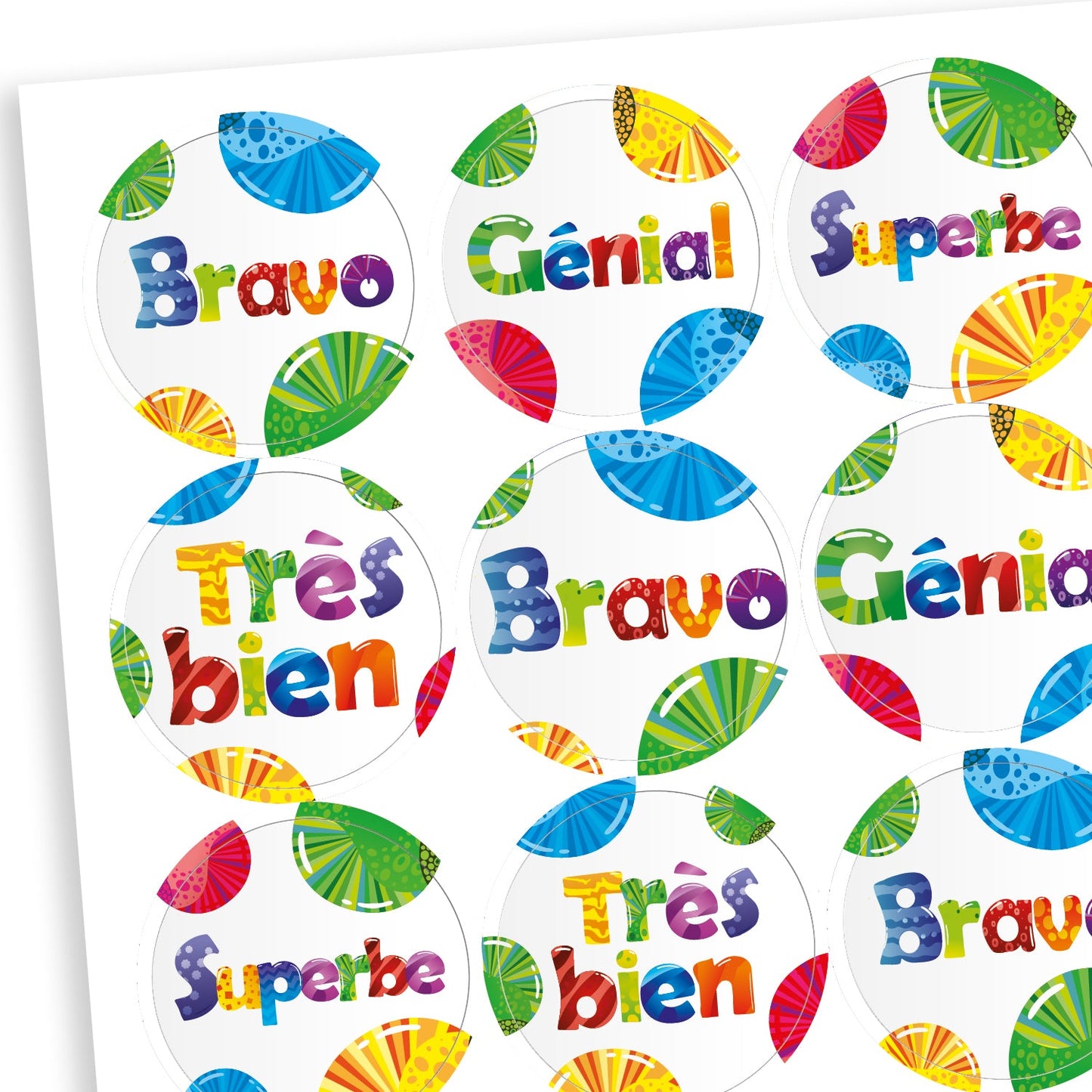 Sheet of bright coloured reward stickers edged with colourful fruit slices. Messages in French include 'Superbe' and 'Bravo!'.