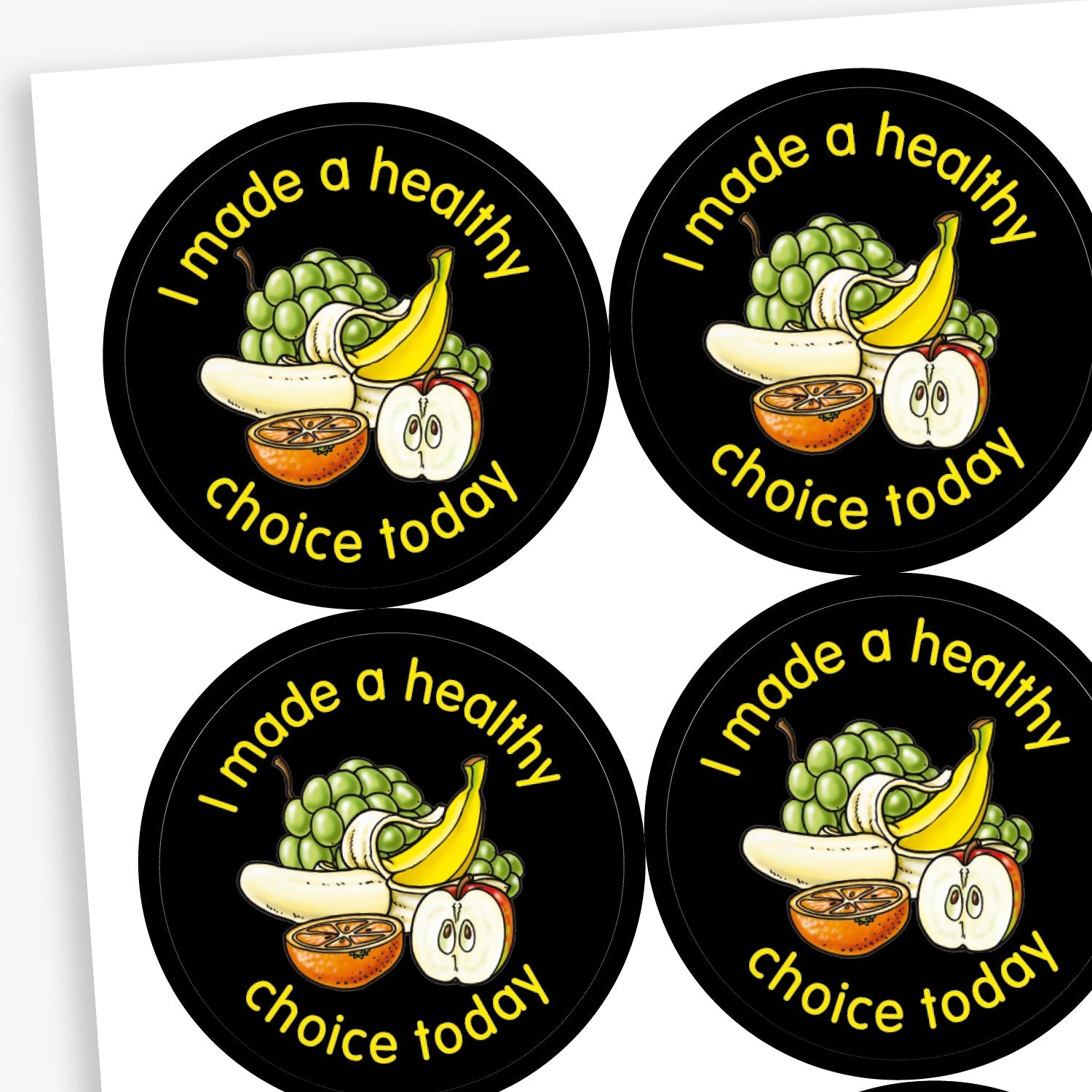 A sheet of circular stickers with a black background. Each sticker features a selection of fruit as a central image including a bunch of grapes, a peeled banana and half an apple and orange. The phrase 'I made a healthy choice today' is written in yellow font around the image.
