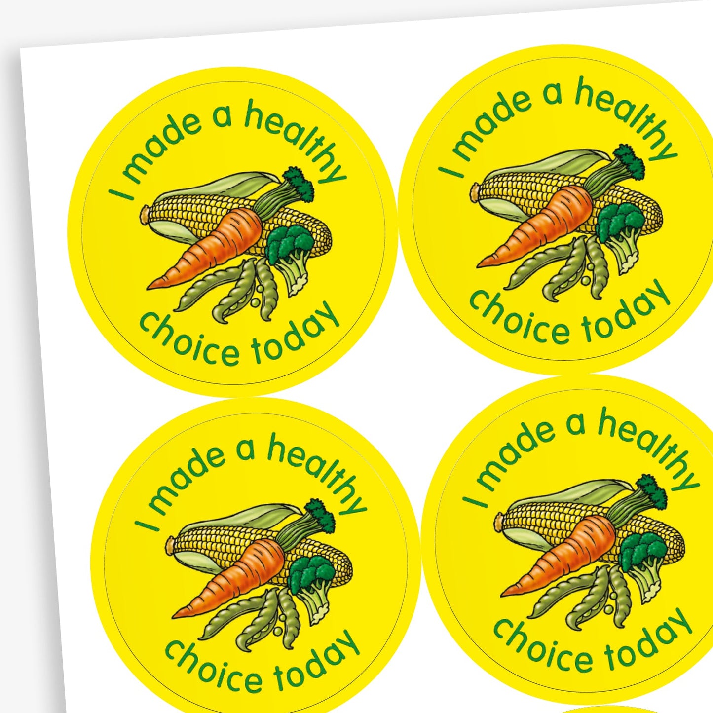 A sheet of circular stickers with a yellow background. Each sticker features a selection of vegetables as a central image including a cob of corn, peas in a pod, brocolli and a carrot. The phrase 'I made a healthy choice today' is written in green font around the image.