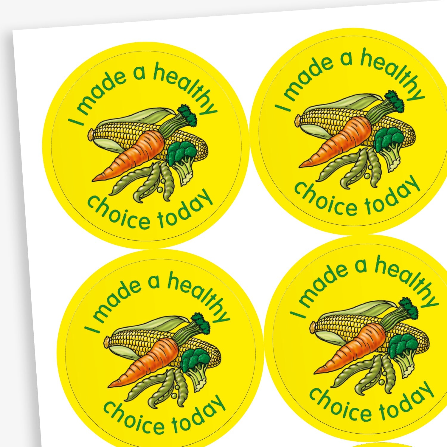 A sheet of circular stickers with a yellow background. Each sticker features a selection of vegetables as a central image including a cob of corn, peas in a pod, brocolli and a carrot. The phrase 'I made a healthy choice today' is written in green font around the image.