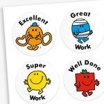 A snapshot of a sheet of circular reward stickers featuring Mr. Men and Little Miss characters on a white background.  Each sticker includes praising phrases 'Great Work', 'Well Done', 'Excellent' and 'Super Work' along with different Little Miss or Mr Men characters.