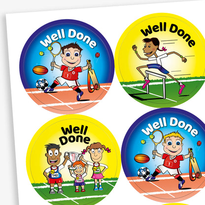 Sheet of circular stickers with bright coloured backgrounds all saying 'Well Done'.  A yellow background has a team of three characters lifting a trophy with '1' on it, the yellow background shows a character hurdling and a blue background with a boy character holding sporting equipment.