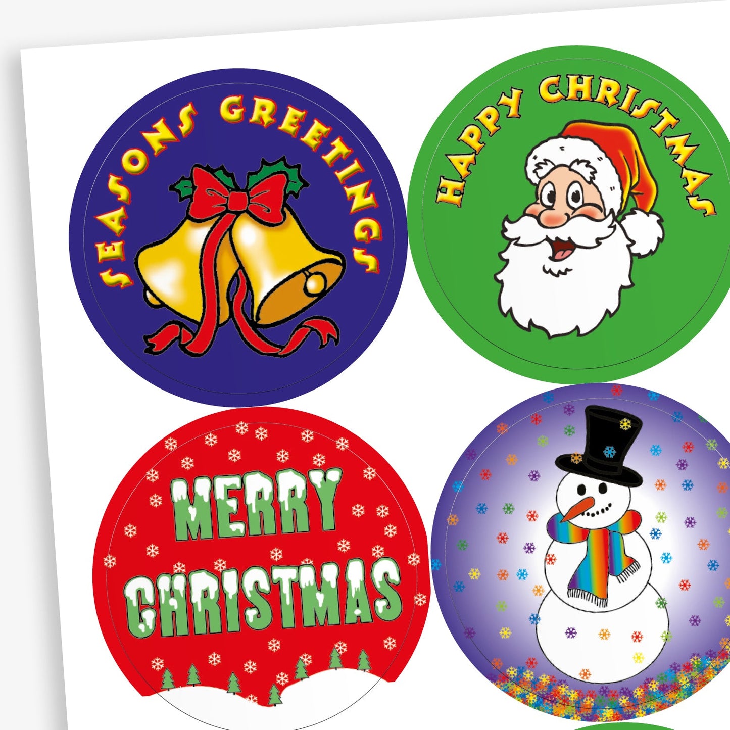A sheet of circular Christmas-themed stickers. Designs include: gold bells with a red ribbon and 'Season’s Greetings' text on a blue background; Santa Claus with 'Happy Christmas' on green; white 'Merry Christmas' text on red with snowflake patterns; and a smiling snowman with a rainbow scarf and top hat on a snowy purple background
