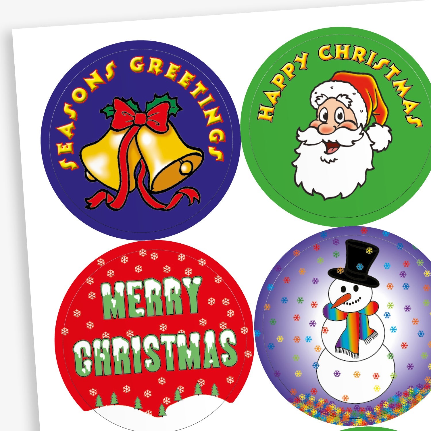 A sheet of circular Christmas-themed stickers. Designs include: gold bells with a red ribbon and 'Season’s Greetings' text on a blue background; Santa Claus with 'Happy Christmas' on green; white 'Merry Christmas' text on red with snowflake patterns; and a smiling snowman with a rainbow scarf and top hat on a snowy purple background