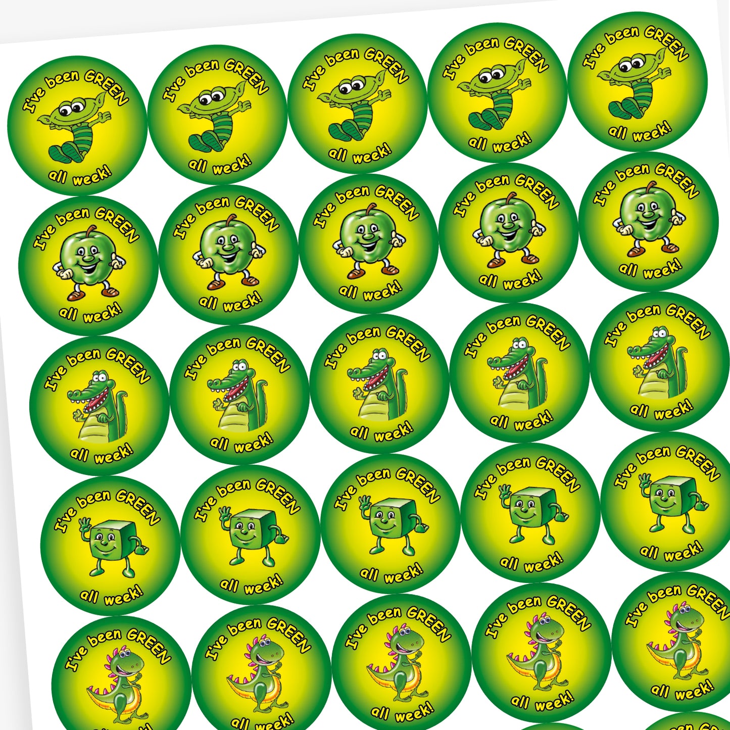 A sheet of round motivational stickers with a green and yellow gradient background. Each sticker features the phrase 'I've been GREEN all week!' in playful black text. The centre of each sticker displays a different cheerful green character: a worm with glasses, a shiny star, a friendly dinosaur, and a smiling apple. These stickers are designed to reward consistent positive behaviour over the week.