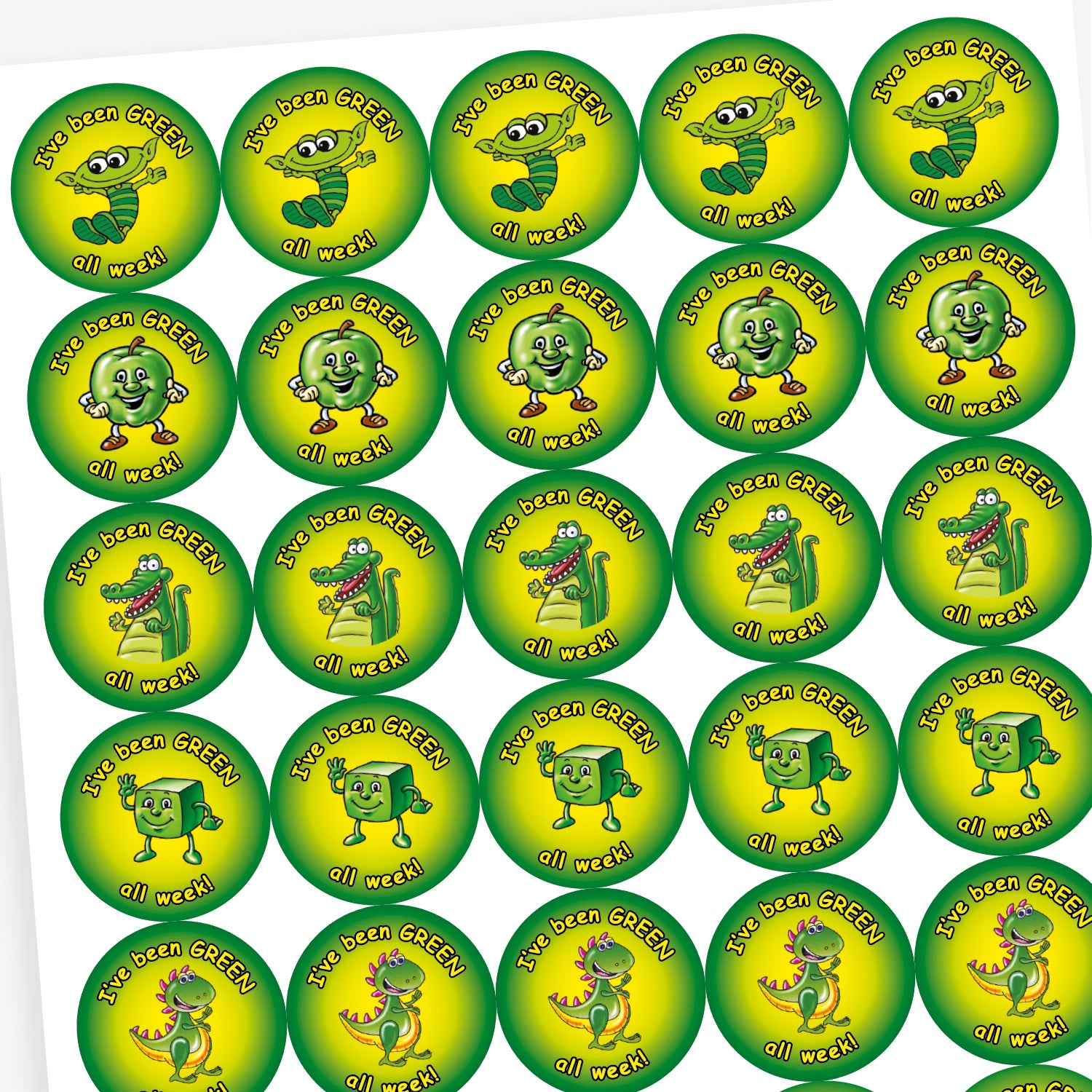 A sheet of round motivational stickers with a green and yellow gradient background. Each sticker features the phrase 'I've been GREEN all week!' in playful black text. The centre of each sticker displays a different cheerful green character: a worm with glasses, a shiny star, a friendly dinosaur, and a smiling apple. These stickers are designed to reward consistent positive behaviour over the week.