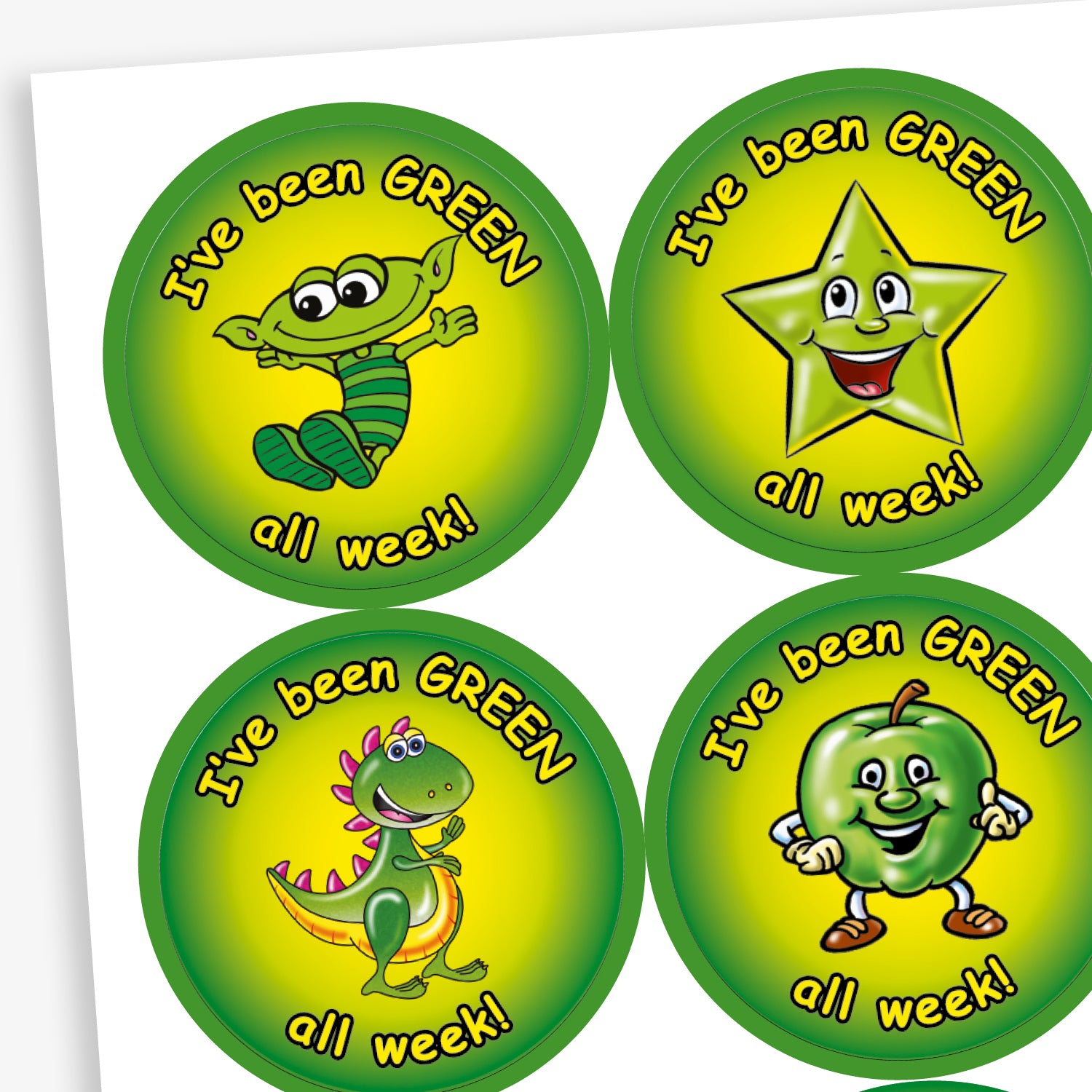 A sheet of round motivational stickers with a green and yellow gradient background. Each sticker features the phrase 'I've been GREEN all week!' in playful black text. The centre of each sticker displays a different cheerful green character: a worm with glasses, a shiny star, a friendly dinosaur, and a smiling apple. These stickers are designed to reward consistent positive behaviour over the week.