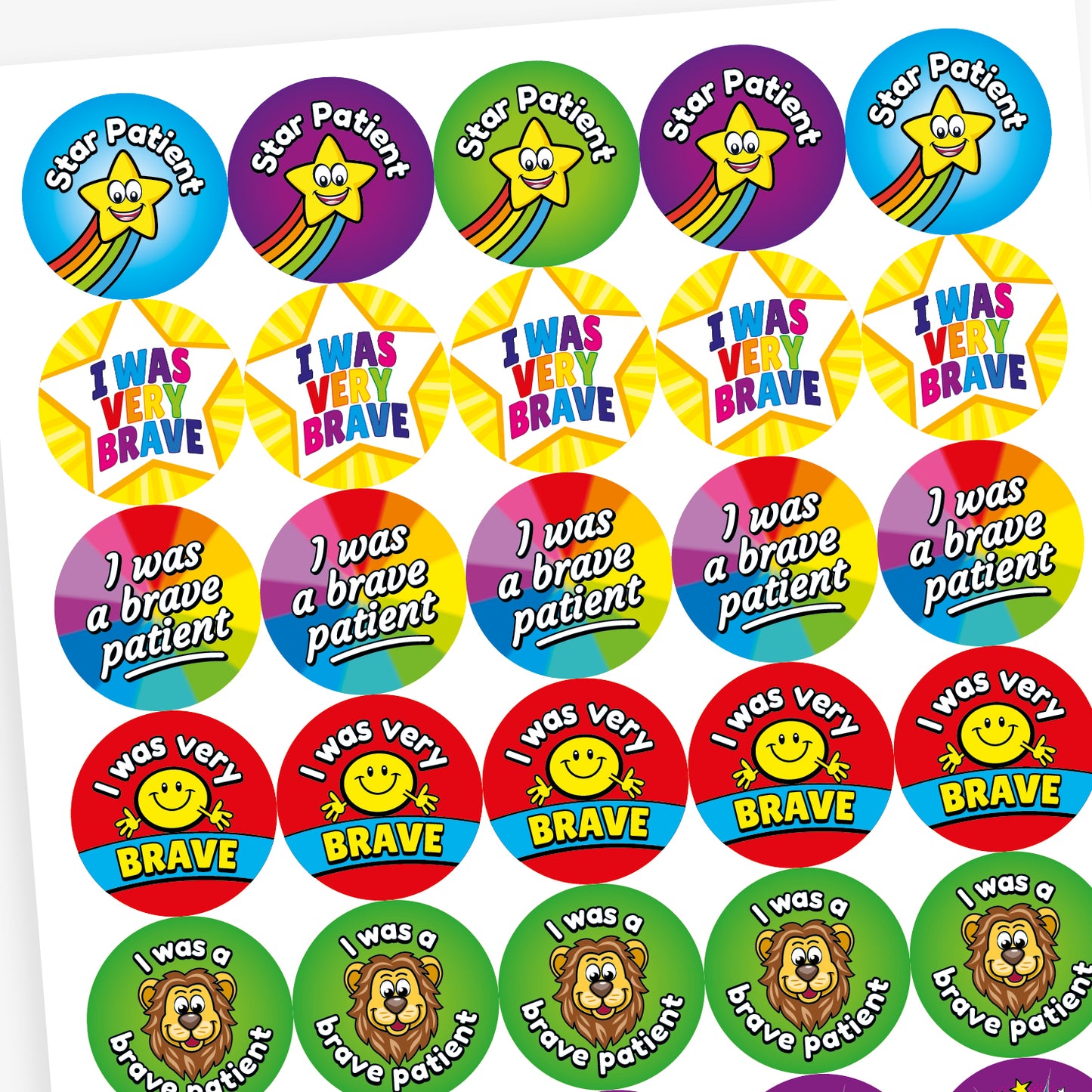 Sheet of colourful circular stickers designed to reward bravery in children. Includes: 'I was a brave patient' written on a rainbow background.  'I WAS VERY BRAVE' inside a yellow star shape. 'I was very BRAVE' with a smiling yellow face on a red and blue background. 'Star Patient' with a smiling yellow star and rainbow trail on a blue background.