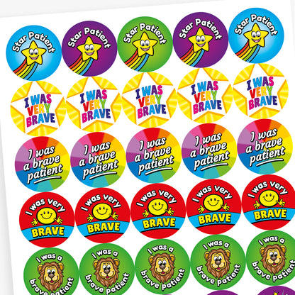 Sheet of colourful circular stickers designed to reward bravery in children. Includes: 'I was a brave patient' written on a rainbow background.  'I WAS VERY BRAVE' inside a yellow star shape. 'I was very BRAVE' with a smiling yellow face on a red and blue background. 'Star Patient' with a smiling yellow star and rainbow trail on a blue background.