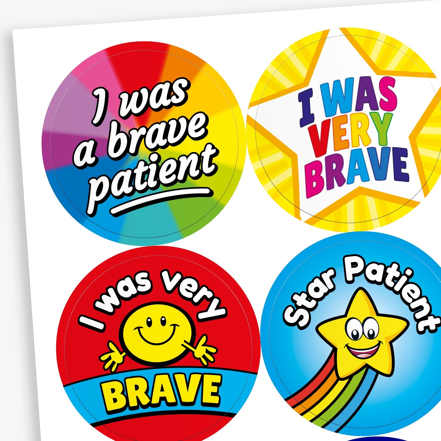 Sheet of colourful circular stickers designed to reward bravery in children. Includes: 'I was a brave patient' written on a rainbow background.  'I WAS VERY BRAVE' inside a yellow star shape. 'I was very BRAVE' with a smiling yellow face on a red and blue background. 'Star Patient' with a smiling yellow star and rainbow trail on a blue background.