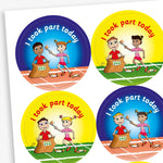 Sheet of circular stickers with bright coloured backgrounds all saying 'I took part today'.  Yellow and blue backgrounds show an athletes partaking in the 'egg and spoon race' and also the 'sack race'