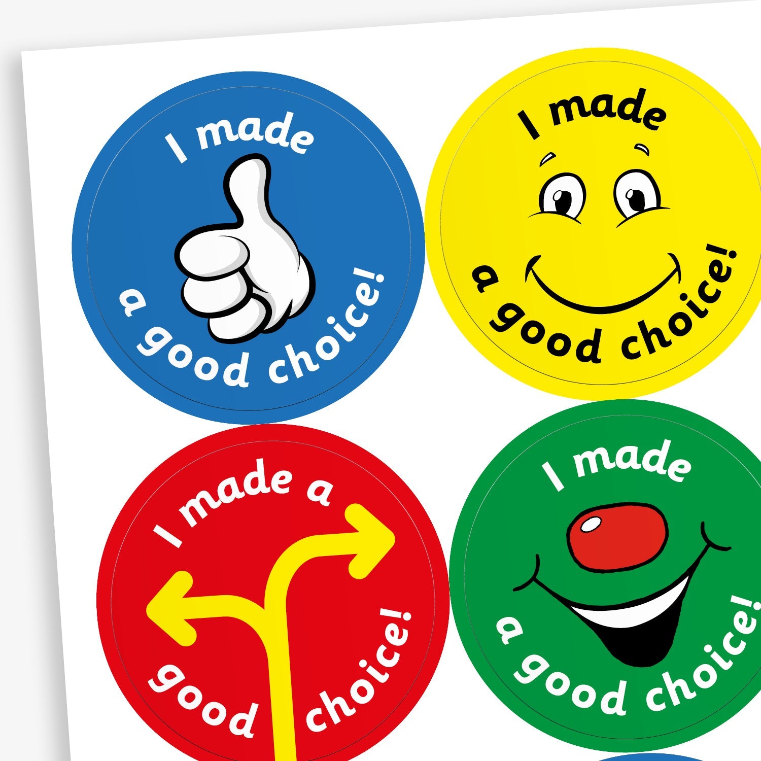 A sheet of four colourful circular reward stickers for children, each with the phrase 'I made a good choice!'. Top left: a blue background with a thumbs-up illustration. Top right: a yellow background with a smiling cartoon face. Bottom left: a red background with a yellow direction sign. Bottom right: a green background with a smiling face featuring a red nose.