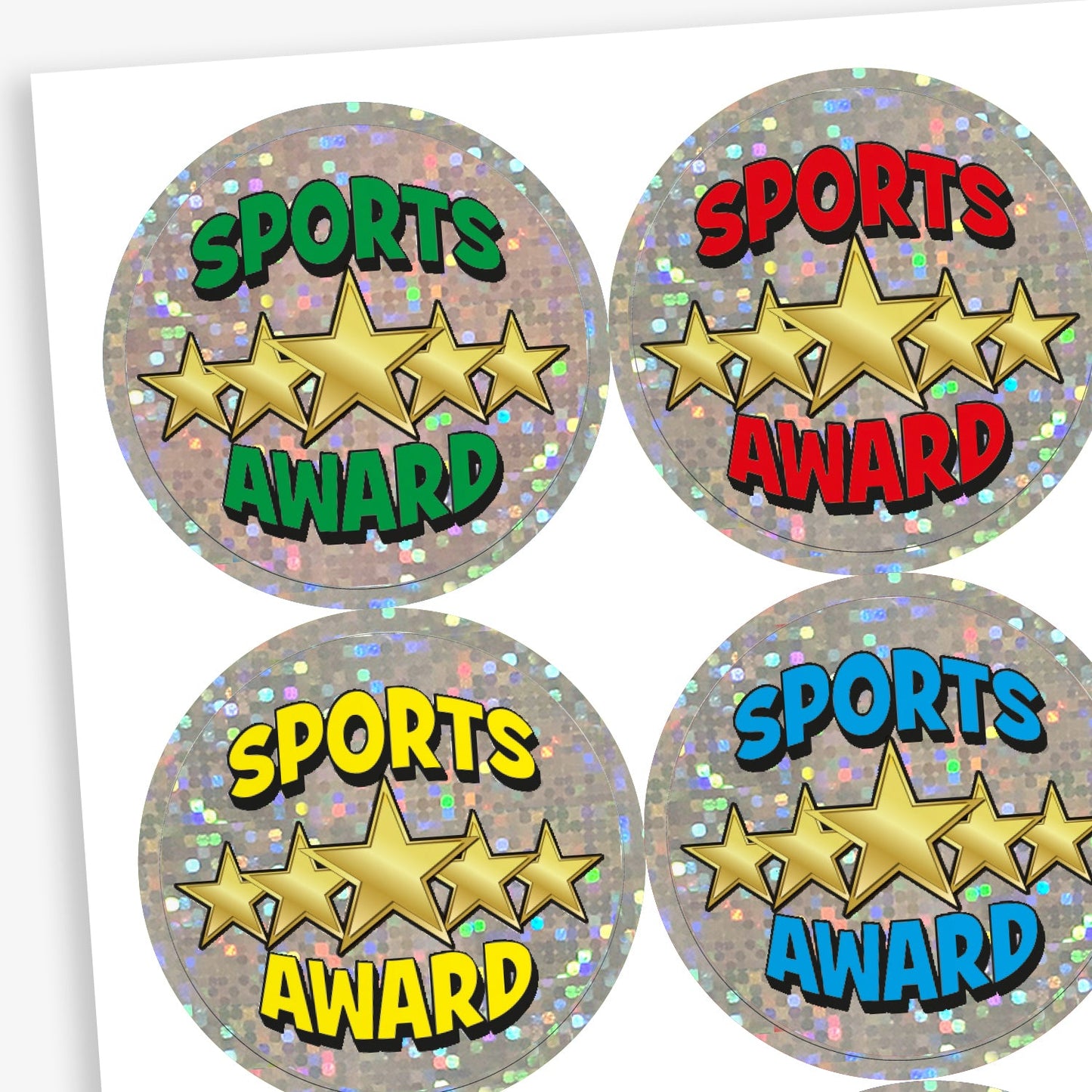 A sheet of circular 'Sports Award' stickers for children, each with a shiny silver holographic background. All stickers feature five gold stars in a row and the words 'SPORTS AWARD' in bold text, with varying colours: green, red, yellow, and blue.
