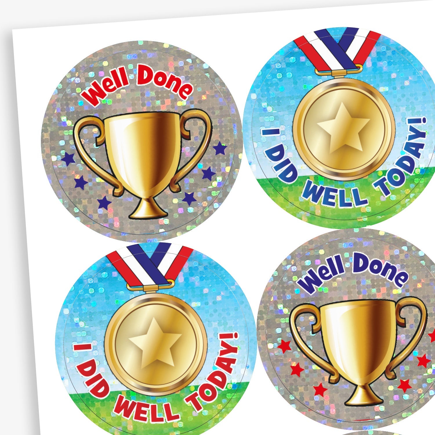 Holographic stickers of two designs, A trophy on a silver background with 'Well Done' above; or a medal agains a filed and sky backdrop and the phrase 'I DID WELL TODAY!'