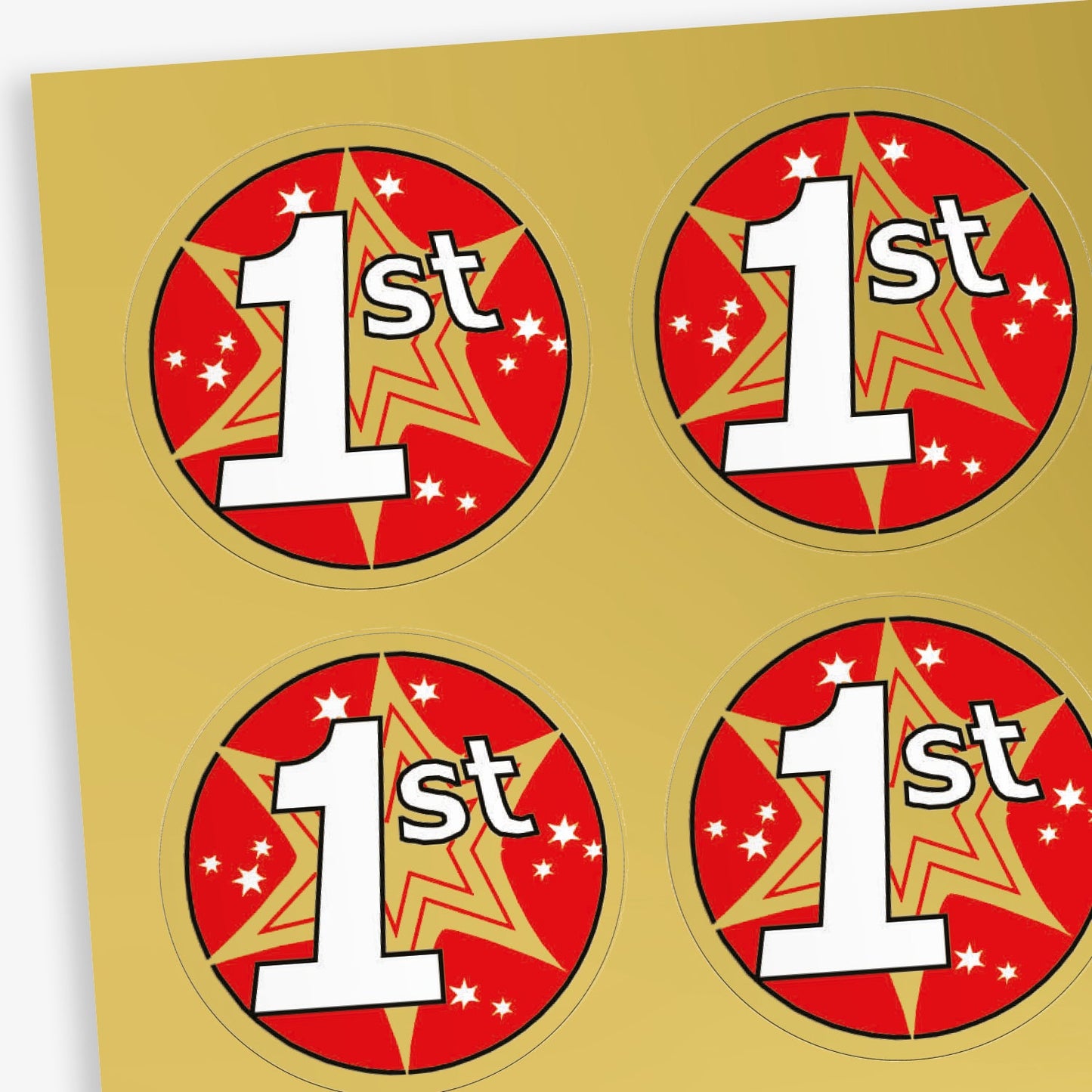 A sheet of metallic gold stickers with a red and gold starburst behind a white font '1st'.