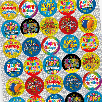 A sheet of colourful, holographic circular 'Happy Birthday' stickers with celebratory designs. Each sticker features bright backgrounds in blue, yellow, and red, decorated with confetti, balloons, and streamers, with bold 'Happy Birthday' text in various styles.