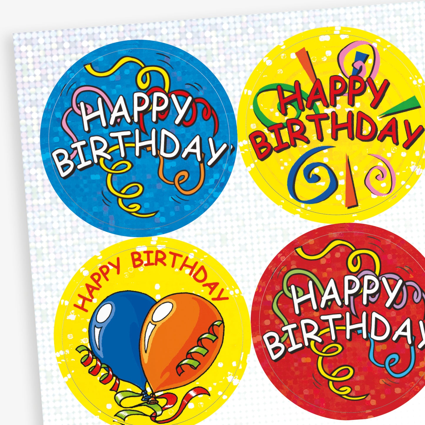 A sheet of colourful, holographic circular 'Happy Birthday' stickers with celebratory designs. Each sticker features bright backgrounds in blue, yellow, and red, decorated with confetti, balloons, and streamers, with bold 'Happy Birthday' text in various styles.