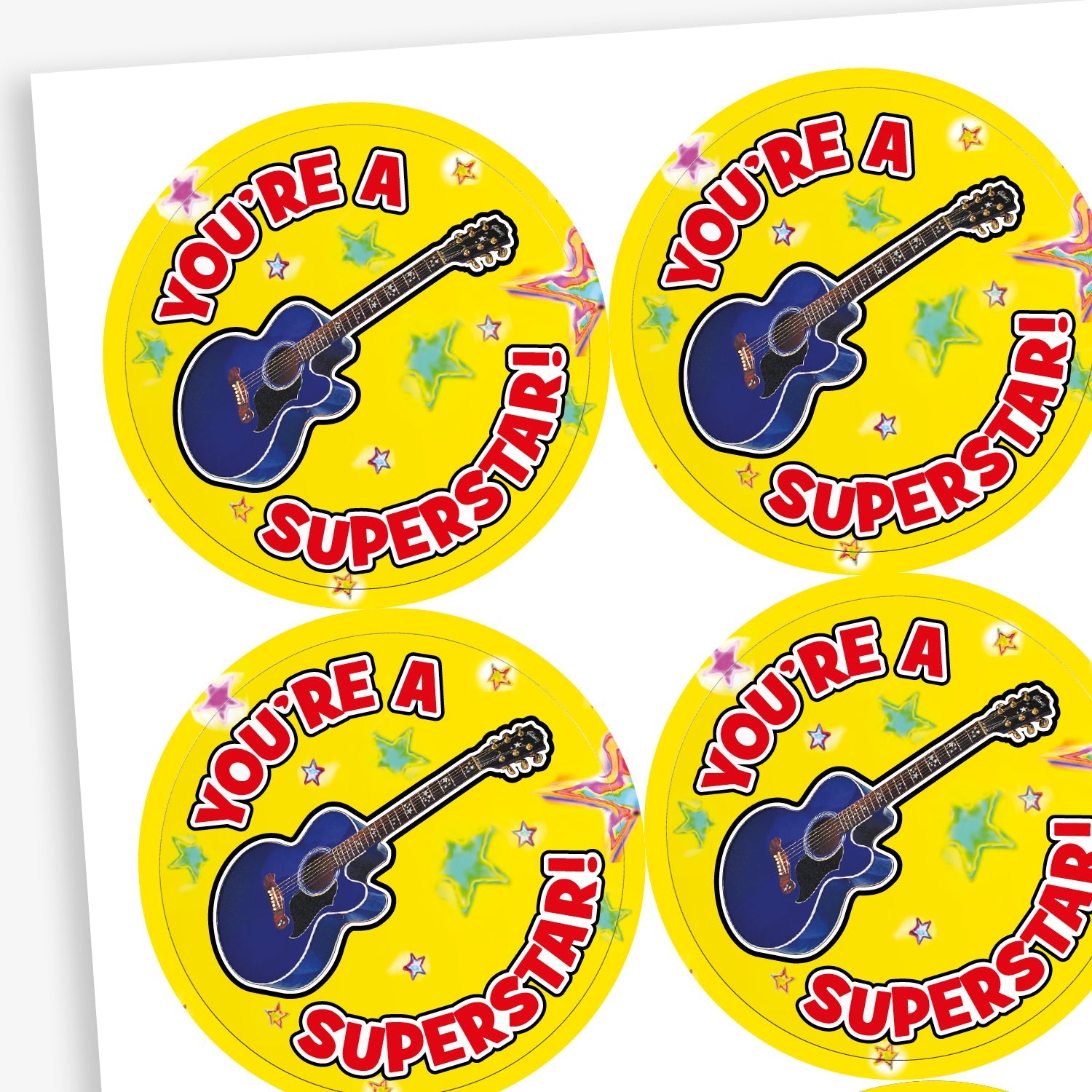 A sheet of yellow stickers featuring a a blue guitar in the centre against a background or stars.  The text 'YOU'RE A SUPERSTAR!' encircles the image.