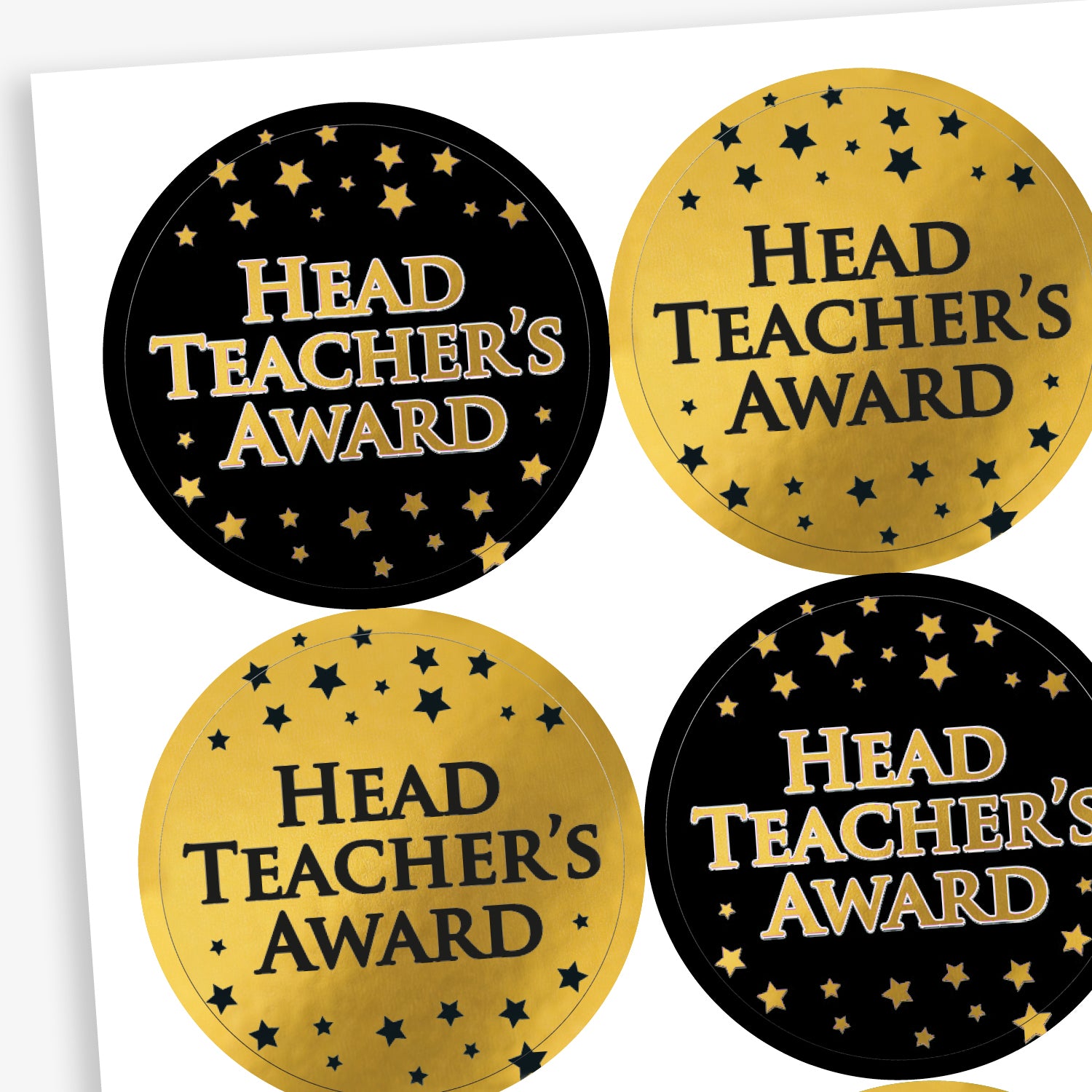 A sheet of 37mm circular stickers featuring a mix of black stickers with gold writing 'HEAD TEACHER'S AWARD' with gold stars, and gold tickers with black writing  'HEAD TEACHER'S AWARD' with black stars
