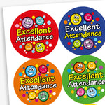 Four colourful circular stickers with smiley faces and the text 'Excellent Attendance'. The stickers are red, blue, orange, and green, each with different combinations of multicoloured smiley face icons and polka dots.