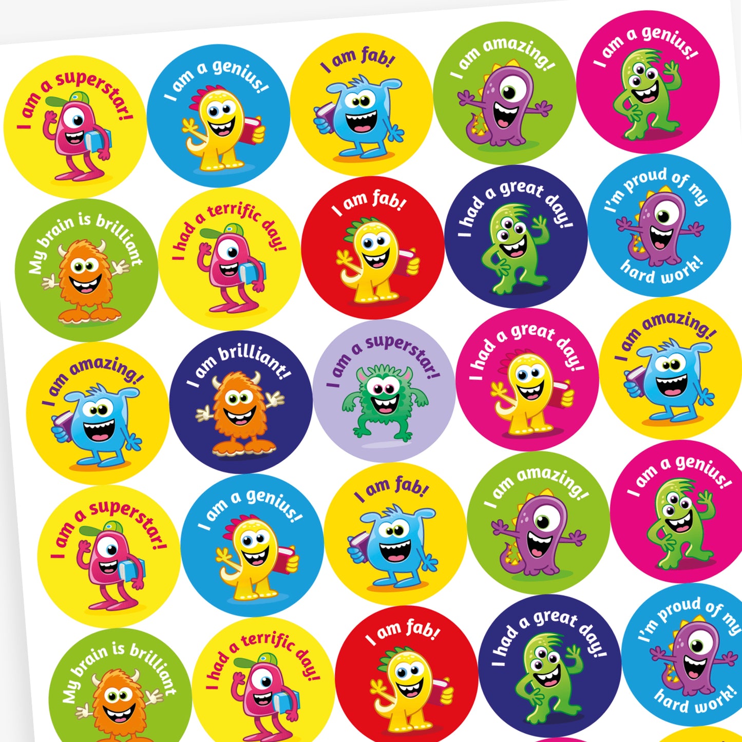 A sheet of vibrant round stickers, each with a monster as the main image and phrases such as 'I am a superstar!', 'I am a genius!', 'I am fab' and 'My brain is brilliant'.