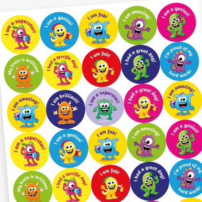 A sheet of vibrant round stickers, each with a monster as the main image and phrases such as 'I am a superstar!', 'I am a genius!', 'I am fab' and 'My brain is brilliant'.