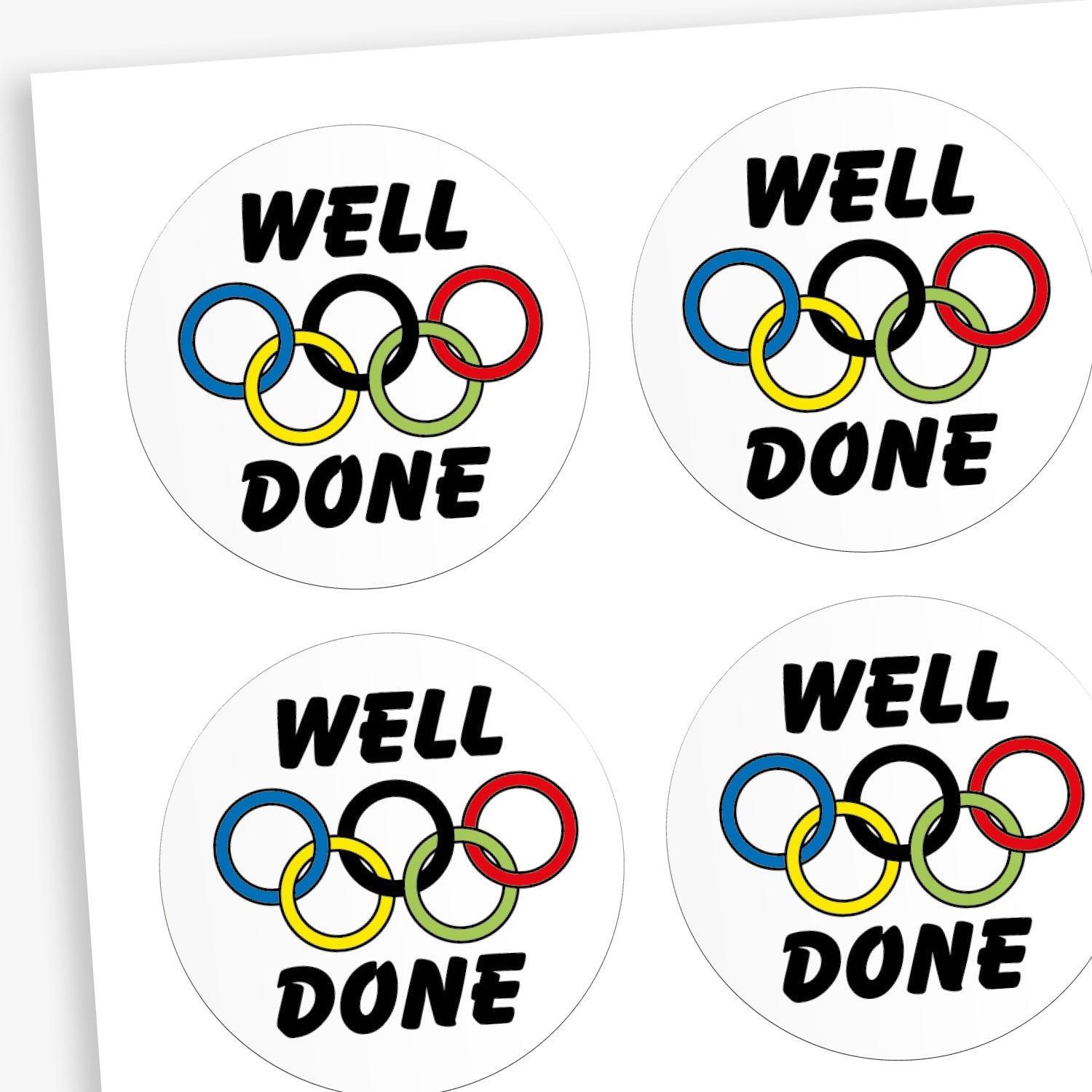 A sheet of white stickers featuring a olympic rings in the centre. Above the image is the word 'WELL' and below the rings 'DONE'.