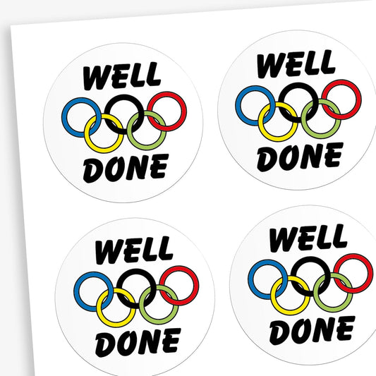 A sheet of white stickers featuring a olympic rings in the centre. Above the image is the word 'WELL' and below the rings 'DONE'.