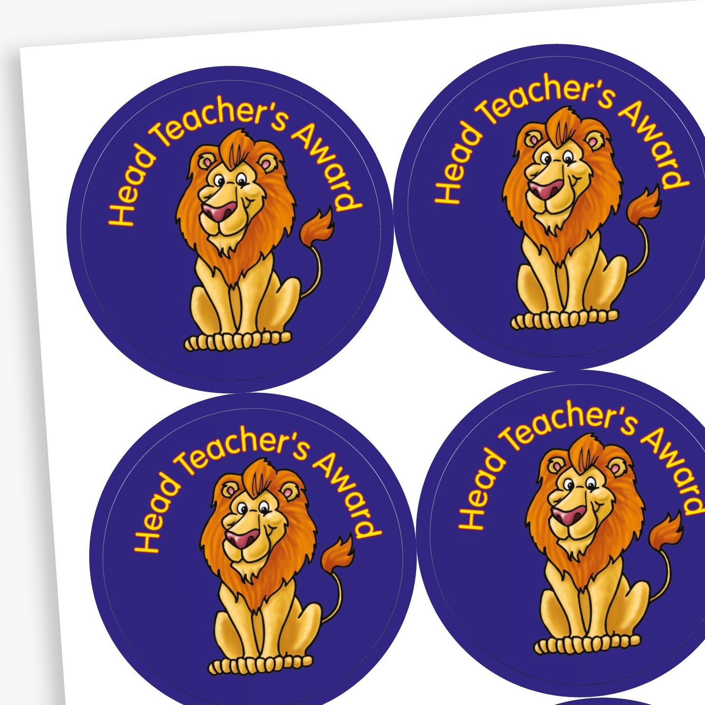A sheet of circular reward stickers for children. Each sticker has a dark blue background, features a cheerful lion sitting downs, and the phrase 'Head Teacher's Award' in gold text above the illustration.