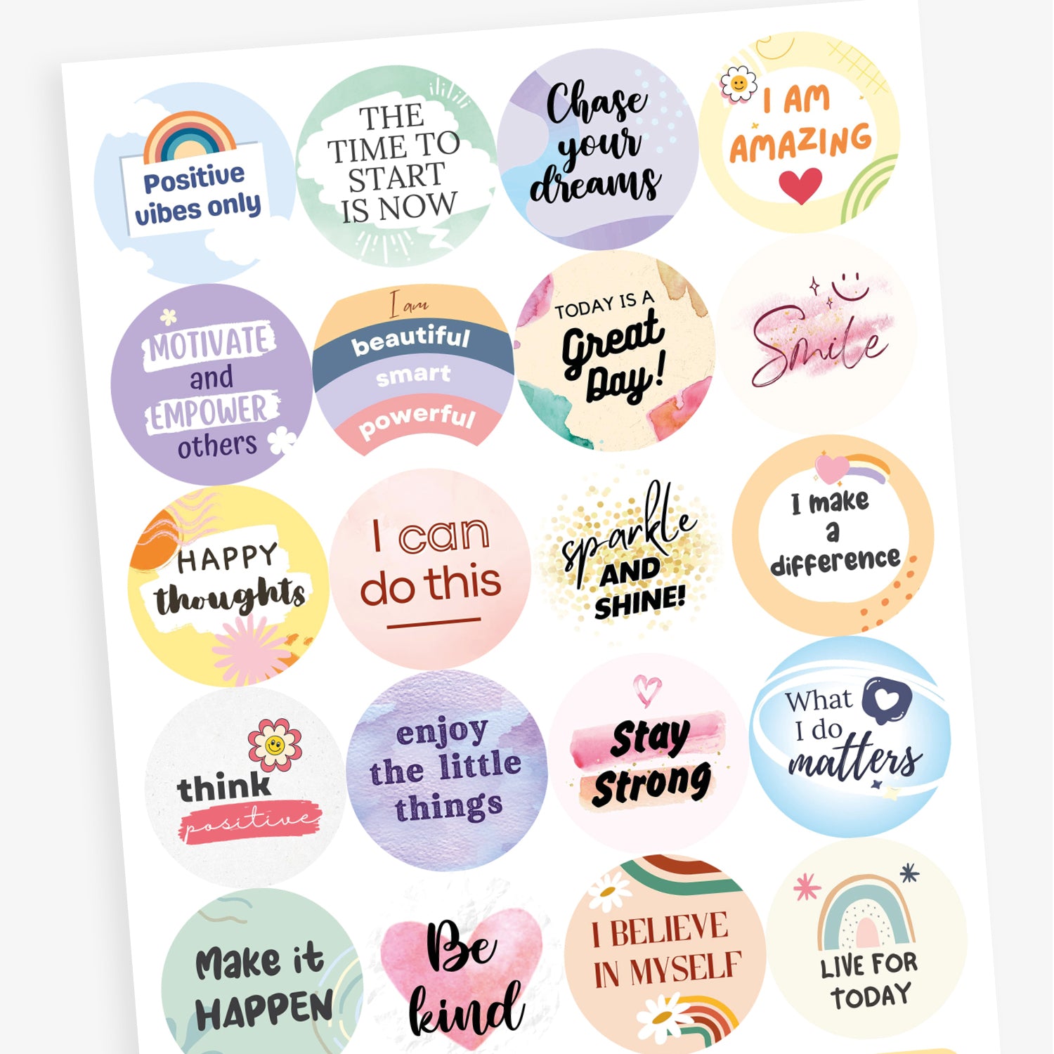 A sheet of round pastel-coloured motivational stickers. Texts include: 'Positive vibes only' with a rainbow, 'The time to start is now', 'Motivate and empower others', and 'I am beautiful, smart, powerful'. Each sticker features soft colours and encouraging typography.