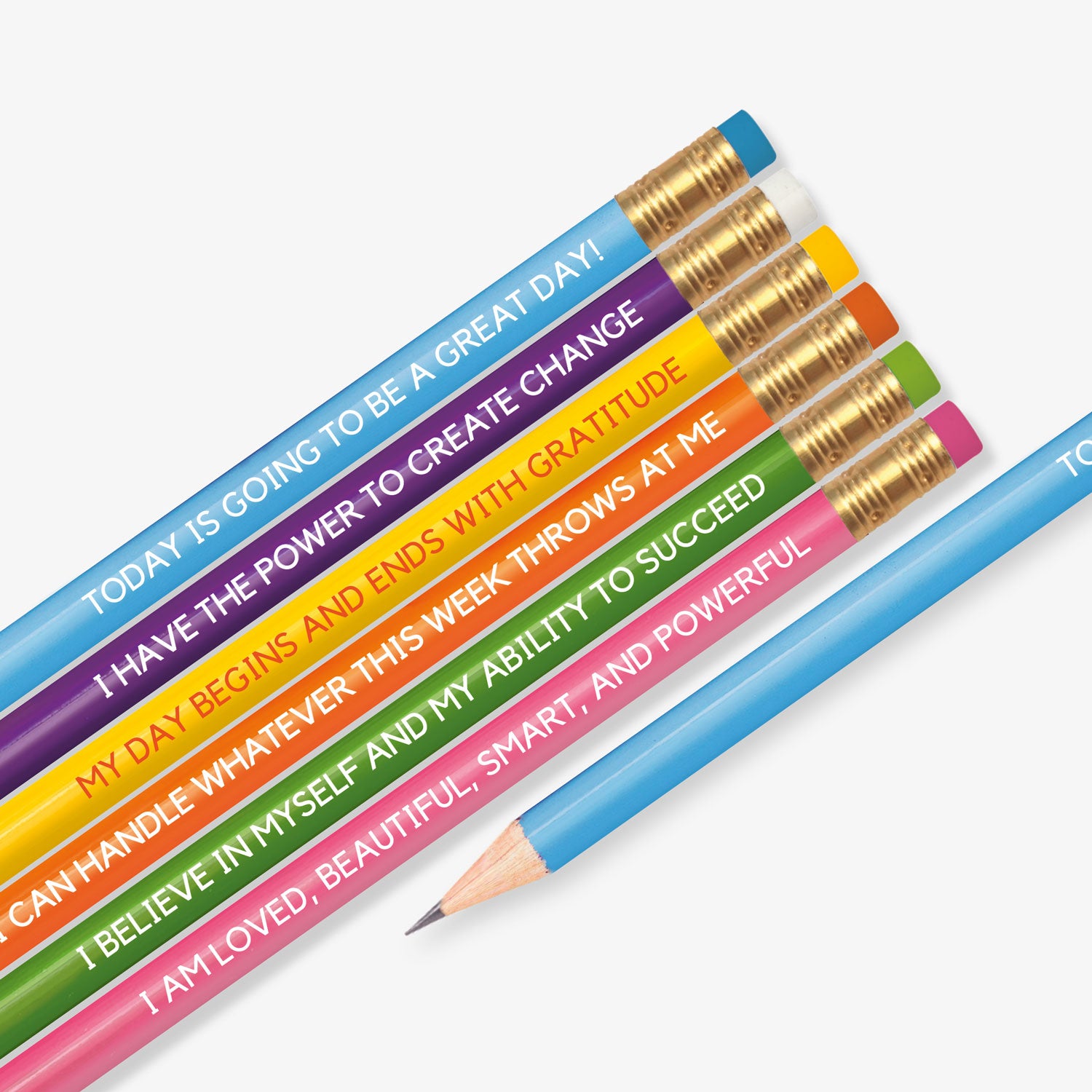 Set of six colourful pencils, each featuring a motivational affirmation. Messages include: 'TODAY IS GOING TO BE A GREAT DAY!', 'I HAVE THE POWER TO CREATE CHANGE', 'MY DAY BEGINS AND ENDS WITH GRATITUDE', 'I CAN HANDLE WHATEVER THIS WEEK THROWS AT ME', 'I BELIEVE IN MYSELF AND MY ABILITY TO SUCCEED', and 'I AM LOVED, BEAUTIFUL, SMART, AND POWERFUL'. Each pencil has a different vibrant colour with a gold ferrule and matching eraser.
