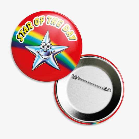 A set of ten 38mm round metal badges featuring a vibrant red background with a smiling silver star character at the centre, displaying the bold text 'Star of the Day' in yellow lettering above the star; designed to reward pupils for outstanding achievements and positive behaviour