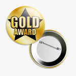Set of 10, 38mm badges.  Gold background with a black star central to the design.  The words 'GOLD AWARD' are written across the star.  The reverse of the badge shows a pin fastening.