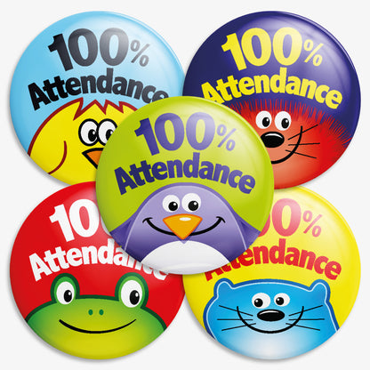 A selection of 38mm round metal badges featuring cheerful cartoon animal faces—such as a smiling blue cat—on a bright yellow background,  a penguin on a lime green background and a frog on a red background.  The phrase '100% Attendance' in bold text is above each image; designed to reward pupils for perfect attendance in educational settings