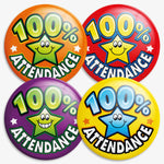 Four brightly coloured circular badges each displaying '100% Attendance' with a smiling cartoon star in the centre. The badges have different background colours: orange with a green star, red with a yellow star, purple with a green star, and yellow with a blue star. Designed to reward perfect school attendance.