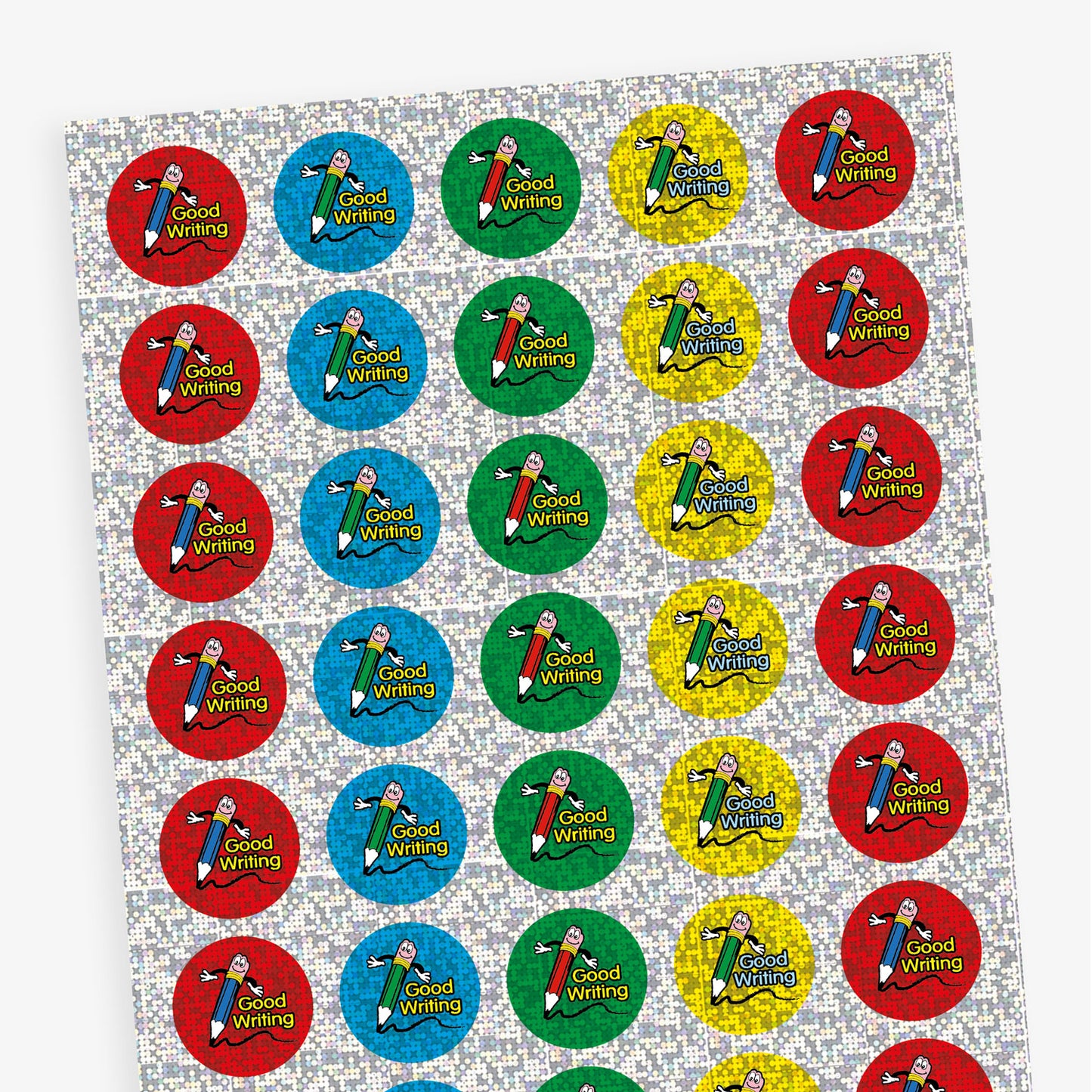 A sheet of circular 'Good Writing' reward stickers with a sparkly blue, red, green or yellow background. Each sticker features a smiling pencil character with the words 'GOOD WRITING' in bold text besides the illustration.