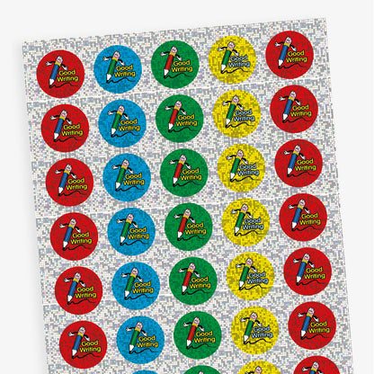 A sheet of circular 'Good Writing' reward stickers with a sparkly blue, red, green or yellow background. Each sticker features a smiling pencil character with the words 'GOOD WRITING' in bold text besides the illustration.