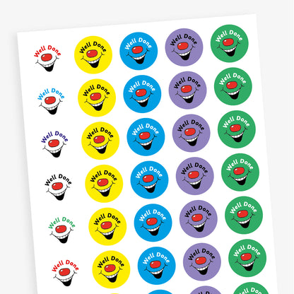 A sheet of colourful circular stickers featuring 'Well Done' against brish colour backgrounds with a red nose and laughing mouth..
