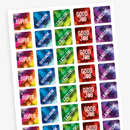 A sheet of square reward stickers with phrases including 'Good Job', 'Awesome', 'Excellent', 'Outstanding' and 'Super'.  The backgrounds are akin to lights through a rainy window and coloured red, purple, green and blue.