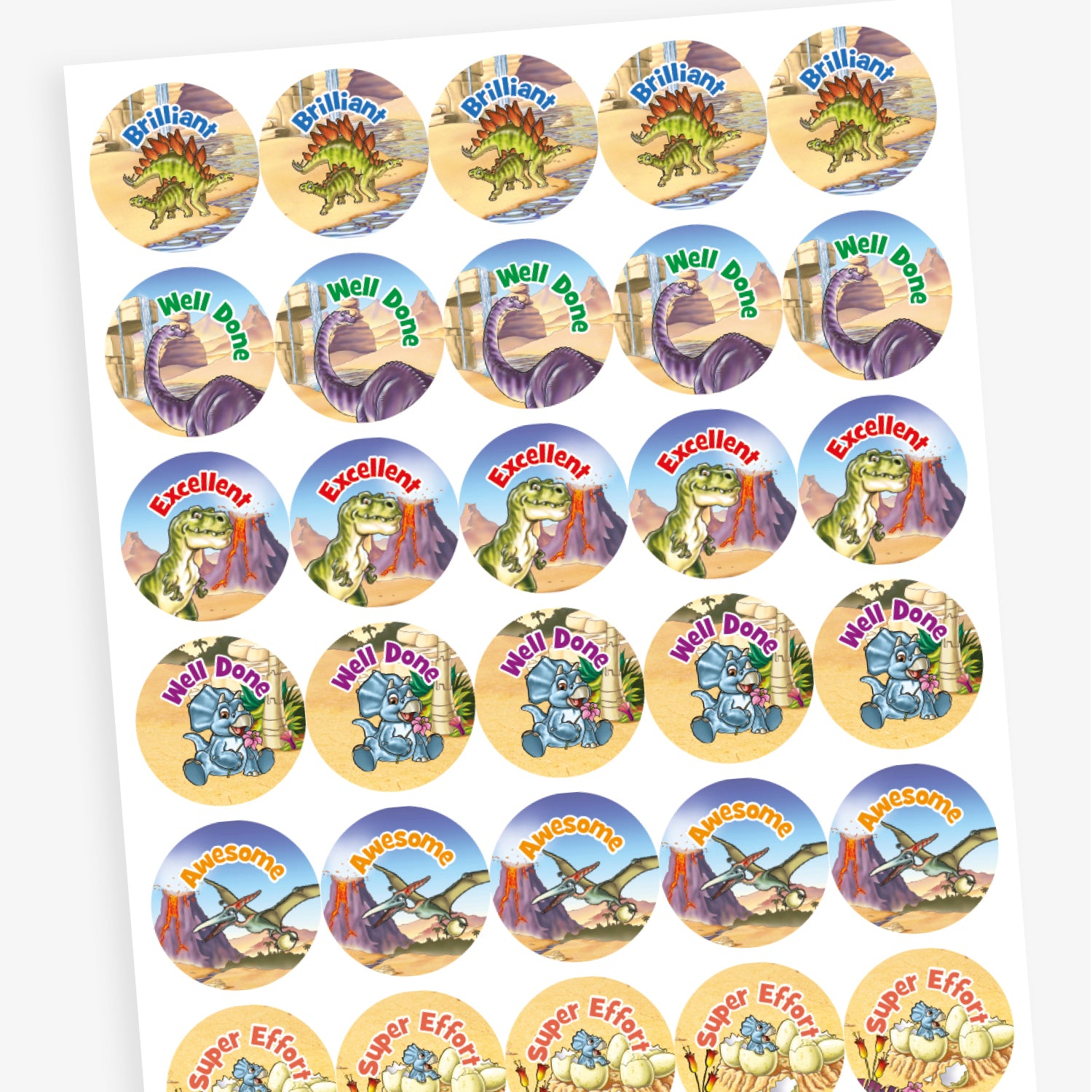 Overview of a sheet of muted coloured reward stickers featuring a variety of dinosaurs against a backdrop deserts, water and a volcano. Messages include 'Well Done', 'Awesome', 'Great Work' and 'Super Effort'