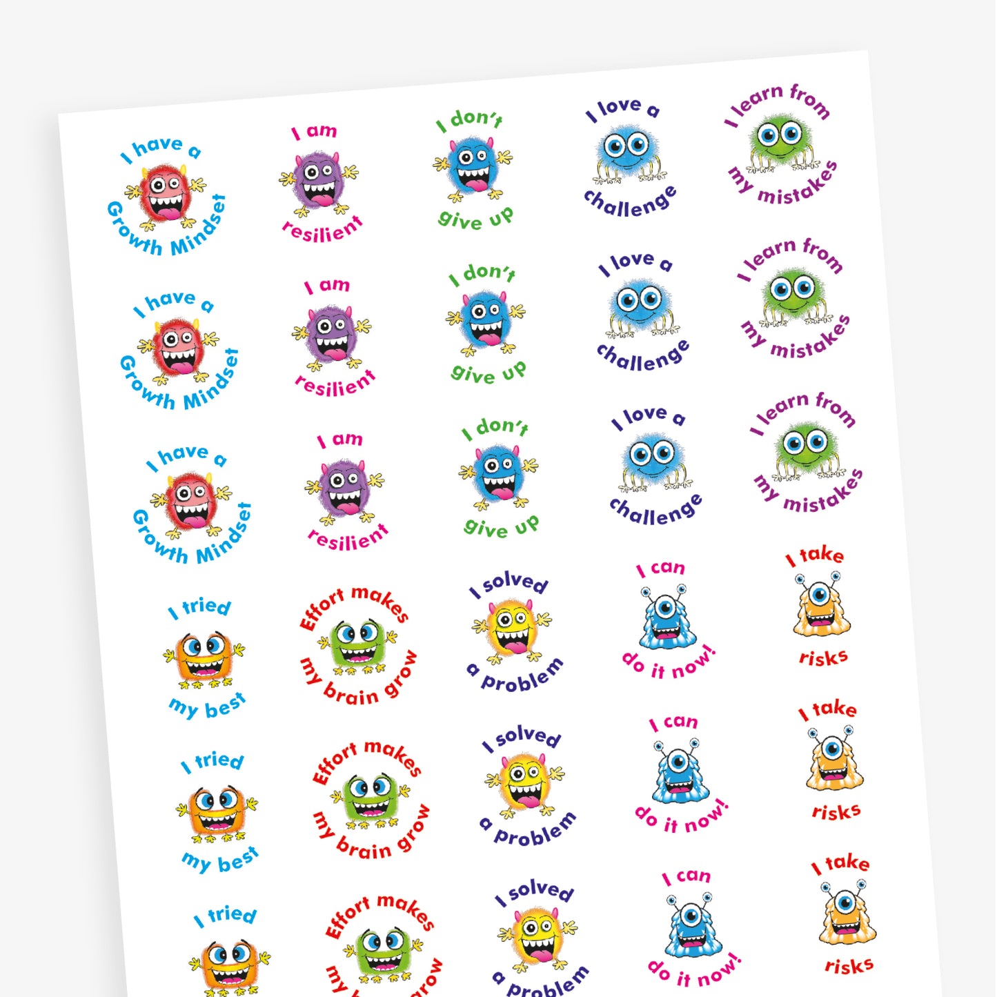 A sheet of circular growth mindset stickers featuring colourful cartoon monsters and motivational phrases. Phrases include: 'I have a Growth Mindset', 'I am resilient', 'I love a challenge', 'Effort makes my brain grow', 'I learn from my mistakes', 'I tried my best', 'I solved a problem', 'I take risks', and 'I can do it now'. Each sticker has a unique monster character and a different bright colour scheme.
