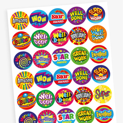 Overview of a sheet of colourful reward stickers featuring a variety of fun designs including solar, arrows, shields, and stars. Messages include 'Well Done', 'Amazing', 'Great', 'Excellent', and 'Great Work'.
