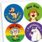 A sheet of circular Spanish stickers including a happy dog with the text '¡Sobresaliente!; a smiling tiger with the text 'Muy Bien'; a cartoon football with the text 'Muy Bien Hecho'; and a polar bear giving a thumbs up with the text '¡Fantástico!'