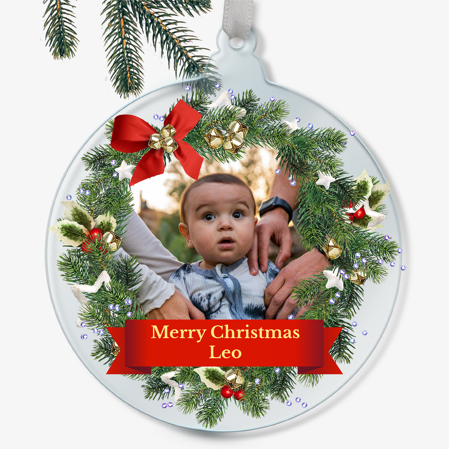 Personalised Christmas ornament with a child's photo and 'Merry Christmas Leo' text.