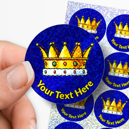 Sticker with a gold crown design and 'Your Text Here' text, held by a hand.