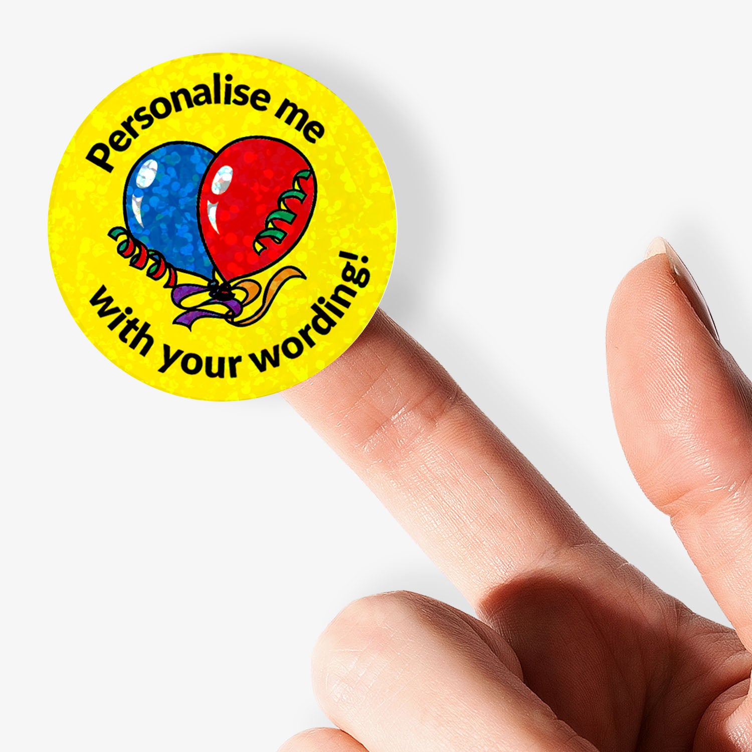 Round sticker with text 'Personalise me with your wording!' held by a finger on a white background