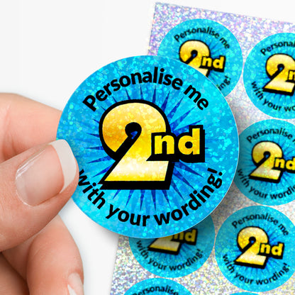 Round blue sticker with 'Personalise me 2nd' text held by a hand