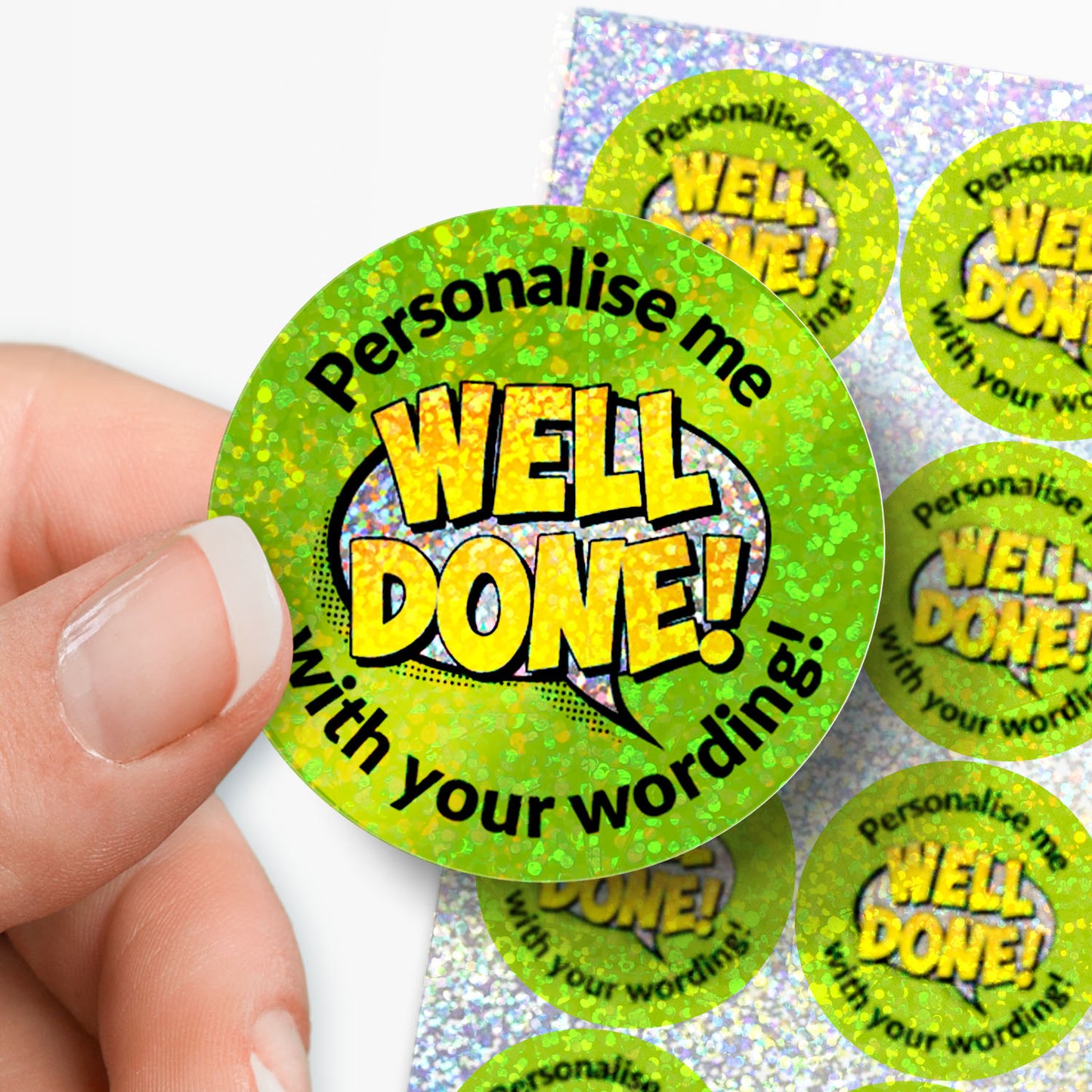 Personalised holographic 'Well Done!' green stickers with a hand holding one.